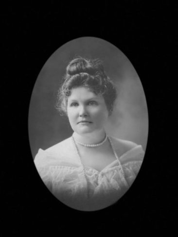 restored portrait of a woman in the early 1900's wearing pearls
